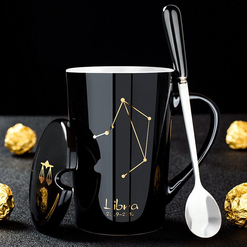 Skanto | Schwarze Keramiktasse mit 12 Sternzeichen, Deckel und Löffel