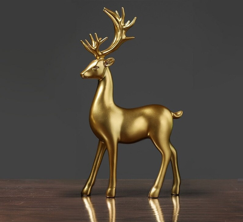 Skanto | Goldene Hirschfiguren