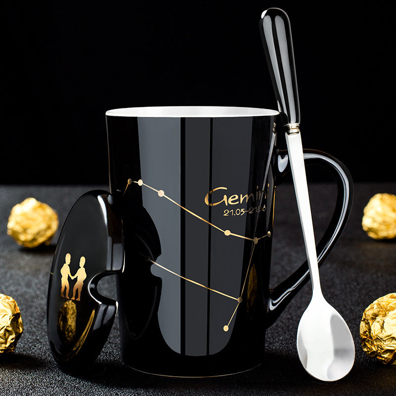 Skanto | Schwarze Keramiktasse mit 12 Sternzeichen, Deckel und Löffel