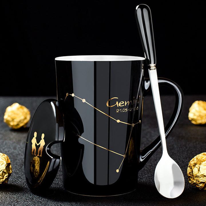 Skanto | Schwarze Keramiktasse mit 12 Sternzeichen, Deckel und Löffel