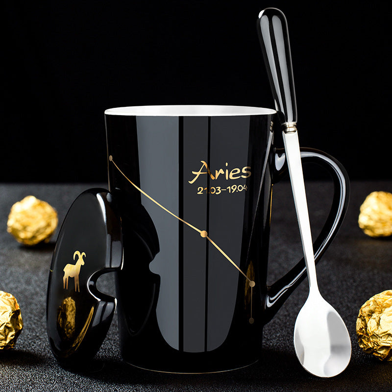 Skanto | Schwarze Keramiktasse mit 12 Sternzeichen, Deckel und Löffel