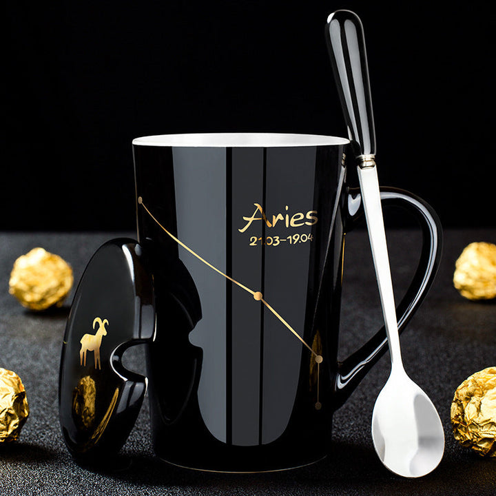 Skanto | Schwarze Keramiktasse mit 12 Sternzeichen, Deckel und Löffel