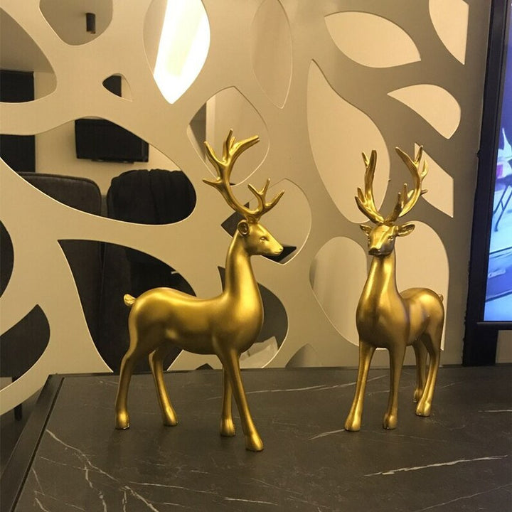 Skanto | Goldene Hirschfiguren
