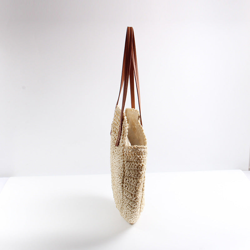 Runde Strohtasche mit eleganten Ledergriffen Skanto