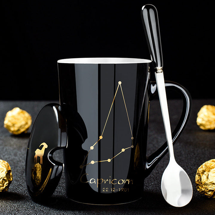 Skanto | Schwarze Keramiktasse mit 12 Sternzeichen, Deckel und Löffel