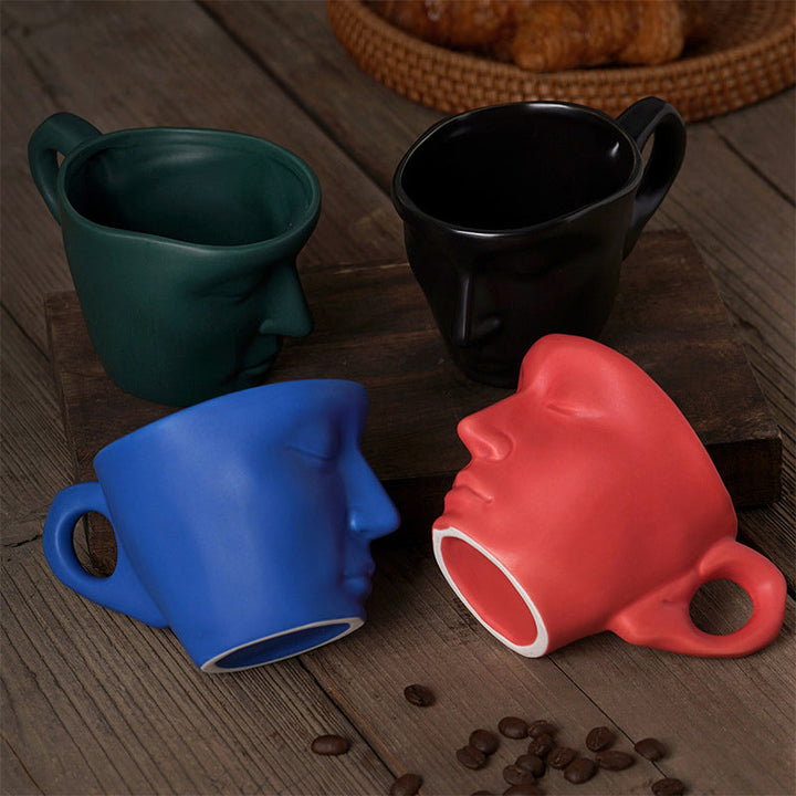 Skanto | Kyssnades Gesichts-Keramik-Kaffeetasse
