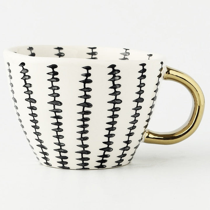 Skanto | Tasse mit abstraktem geometrischem Muster und Goldgriff