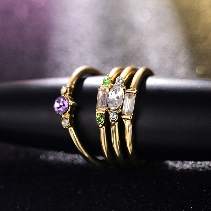 Skanto | Geometrisches Goldfarbenes Kombinations-Ring-Set mit runden Zirkonkristallen