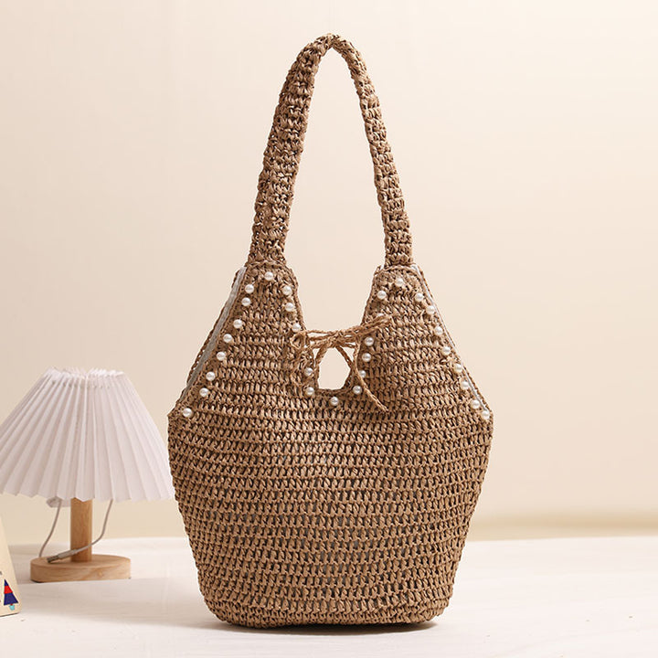 Handtasche mit Perlenverzierungen und innovativem Verschluss Skanto