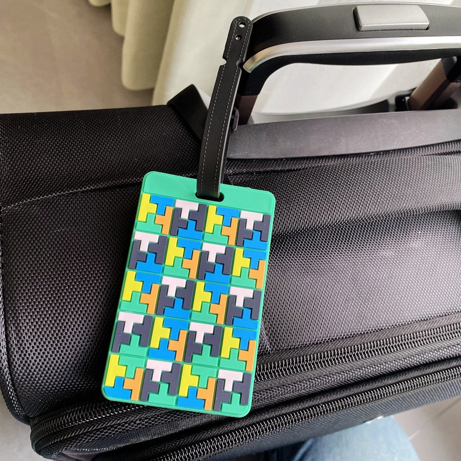 Lebhafter Puzzle-Muster Kofferanhänger Skanto