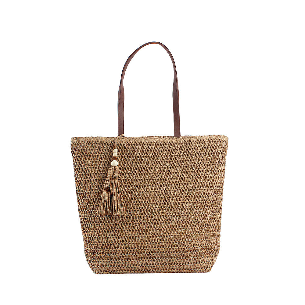 Geräumige Clutch aus geflochtenem Naturmaterial mit dekorativer Quaste Skanto