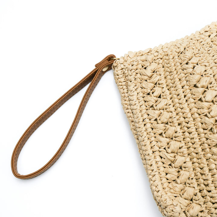 Handtasche aus geflochtenem Naturmaterial mit Quaste Skanto