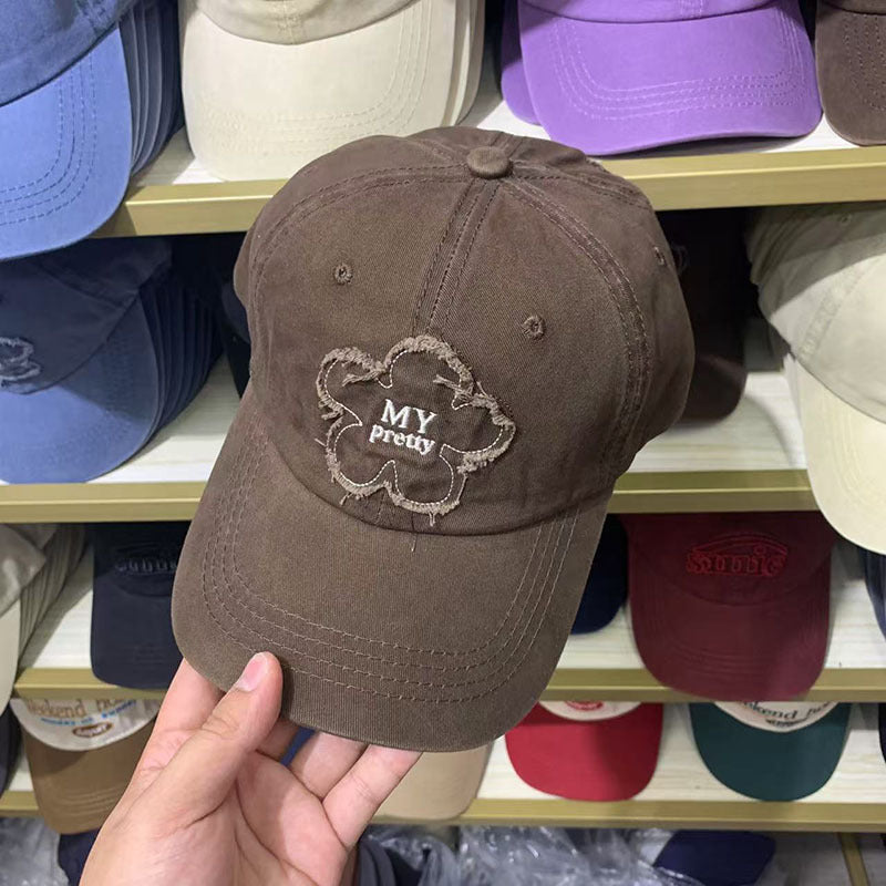 Damen Baseballkappe im Used-Look mit Blumenstickerei Skanto