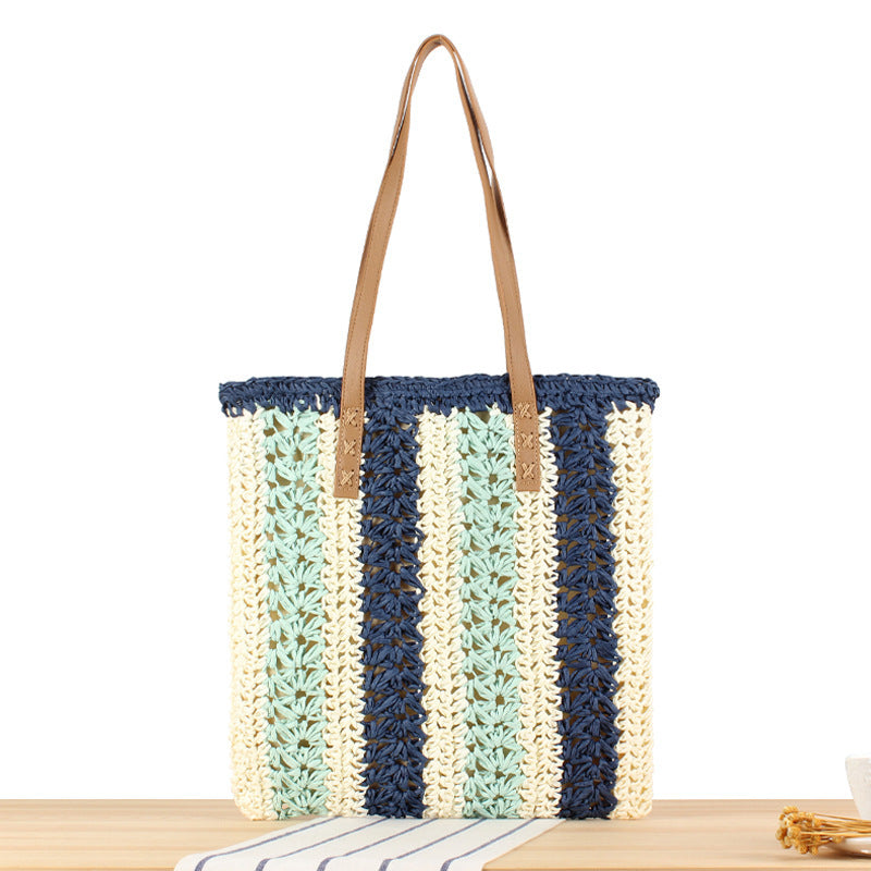 Strandtasche aus gewebtem Naturmaterial mit stabilen Ledergriffen Skanto