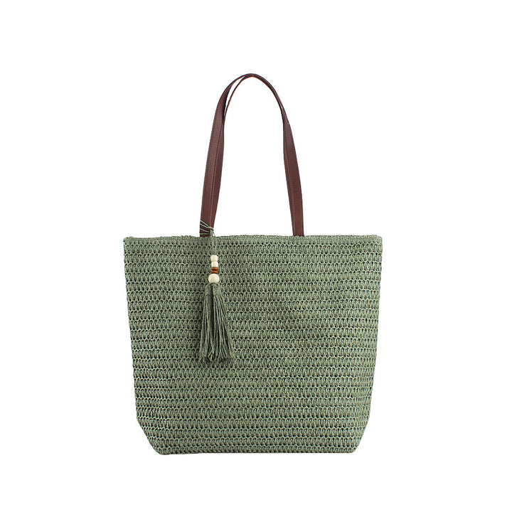 Geräumige Clutch aus geflochtenem Naturmaterial mit dekorativer Quaste Skanto