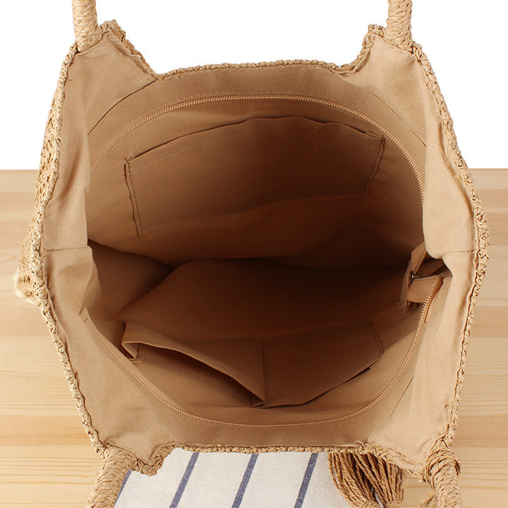 Moderne Strand-Einkaufstasche aus gewebtem Naturmaterial mit Fransen-Details Skanto