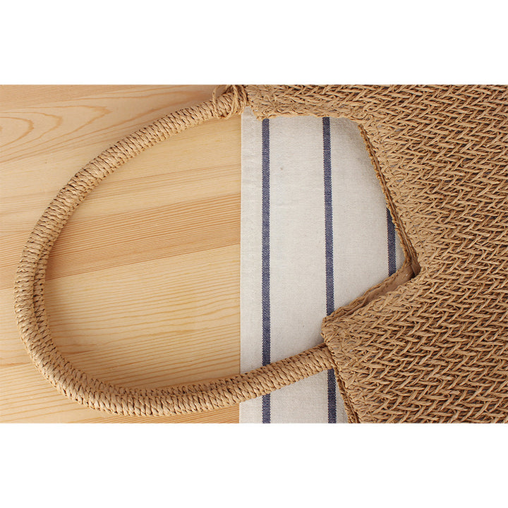 Moderne Strand-Einkaufstasche aus gewebtem Naturmaterial mit Fransen-Details Skanto