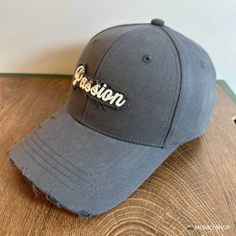 Damen Baseballkappe aus Baumwolle im Used-Look mit gesticktem Zitat Skanto