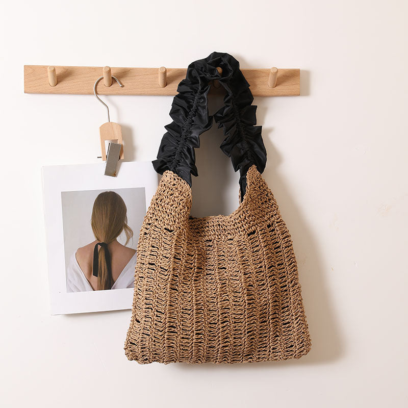 Elegante Handtasche mit gerafftem Ziergriff Skanto