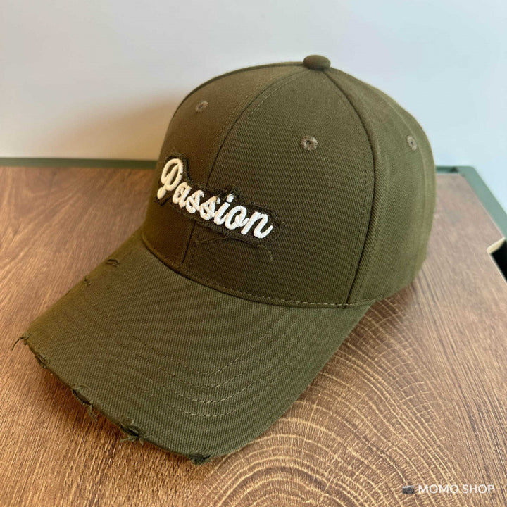 Damen Baseballkappe aus Baumwolle im Used-Look mit gesticktem Zitat Skanto