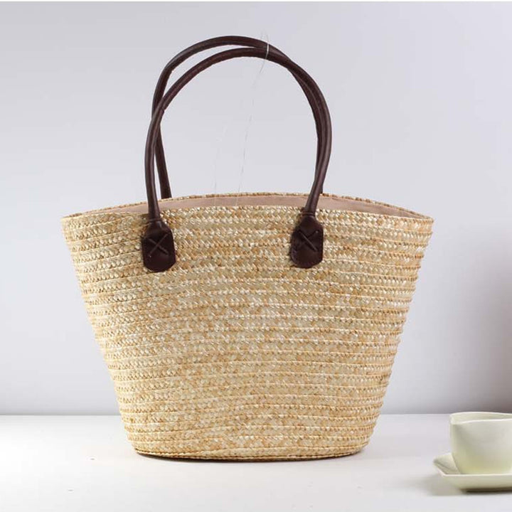 Geflochtene Strandtasche mit farbenfrohem Stickmuster Skanto