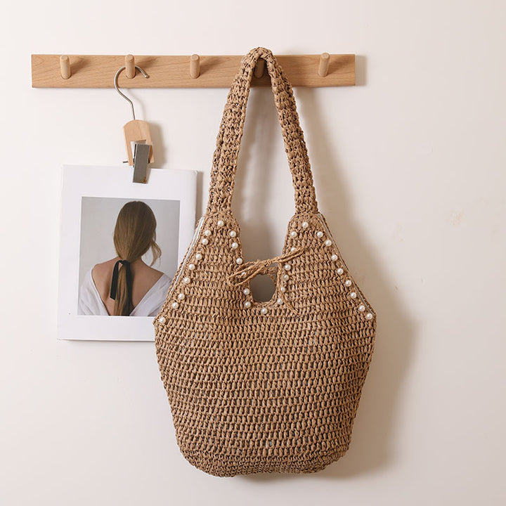 Handtasche mit Perlenverzierungen und innovativem Verschluss Skanto