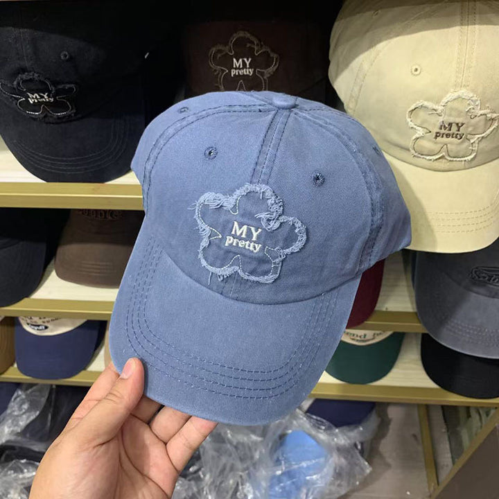 Damen Baseballkappe im Used-Look mit Blumenstickerei Skanto