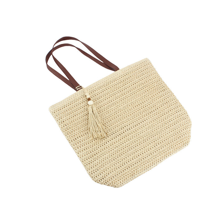 Geräumige Clutch aus geflochtenem Naturmaterial mit dekorativer Quaste Skanto