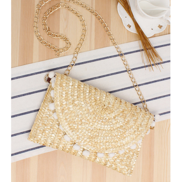 Handgewebte Raffia-Clutch mit dekorativen Pompons Skanto