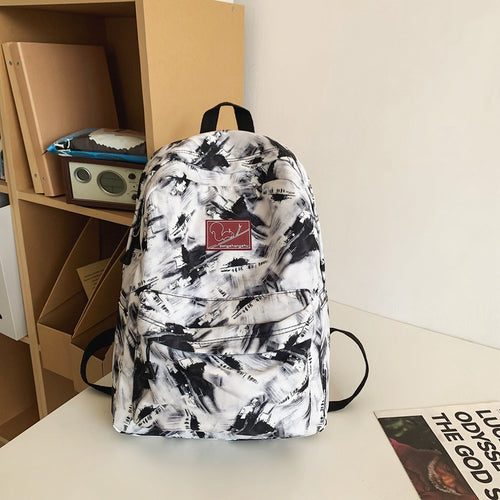 Multifunktionaler Schulrucksack mit abstraktem Print