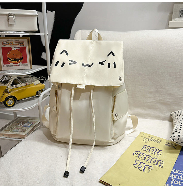 Niedlicher Rucksack mit Cartoon-Gesicht Skanto