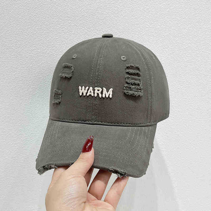 Damen Baumwoll-Cap im Used-Look mit gestickter Botschaft Skanto
