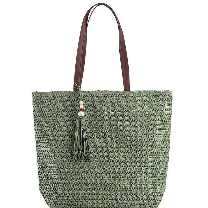 Geräumige Clutch aus geflochtenem Naturmaterial mit dekorativer Quaste Skanto