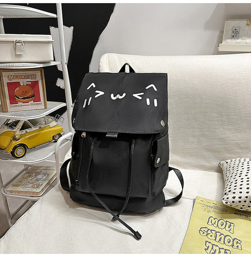Niedlicher Rucksack mit Cartoon-Gesicht Skanto