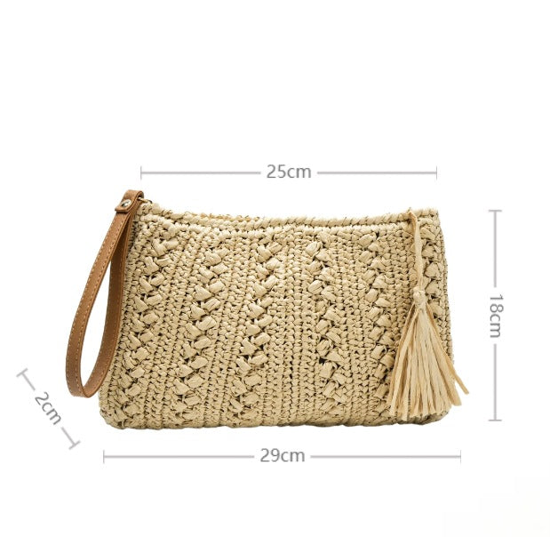 Handtasche aus geflochtenem Naturmaterial mit Quaste Skanto