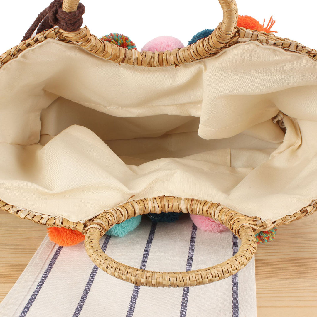 Strohtasche mit bunten Quasten und Pompons Skanto