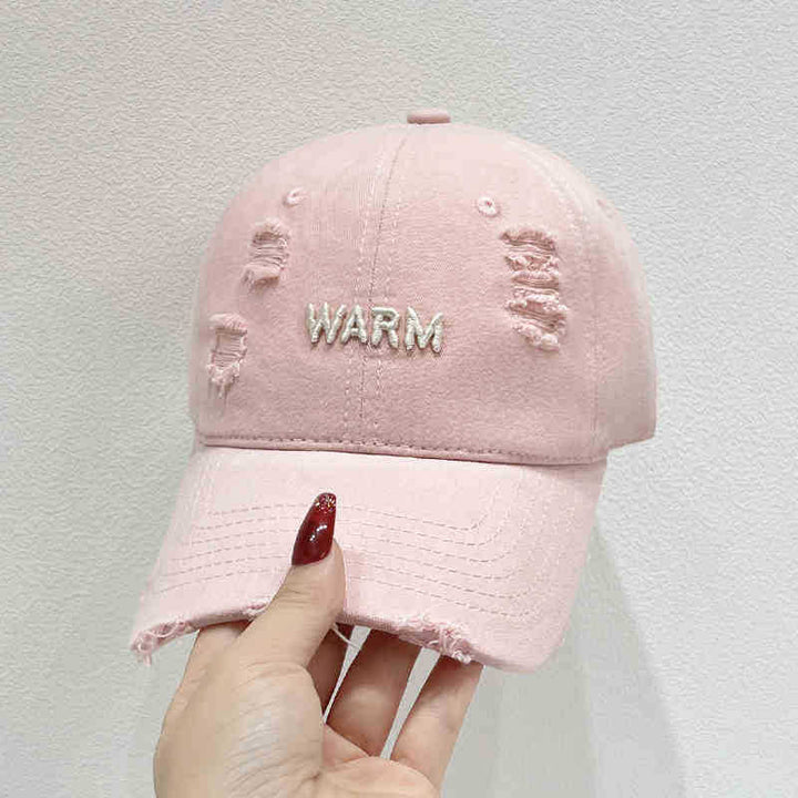 Damen Baumwoll-Cap im Used-Look mit gestickter Botschaft Skanto