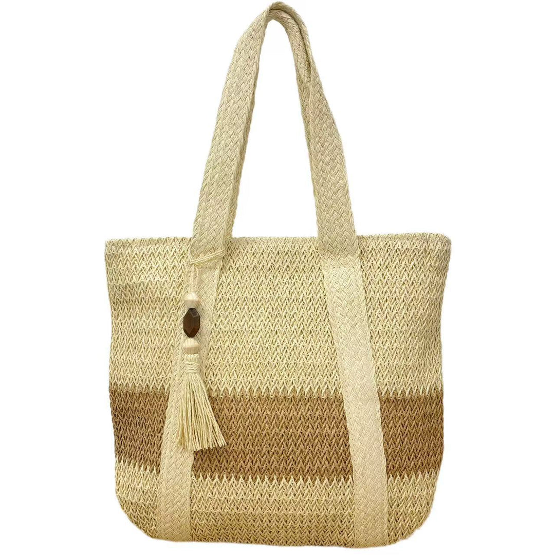 Handtasche aus natürlichem, handgewebtem Stroh mit eleganten Fransen Skanto