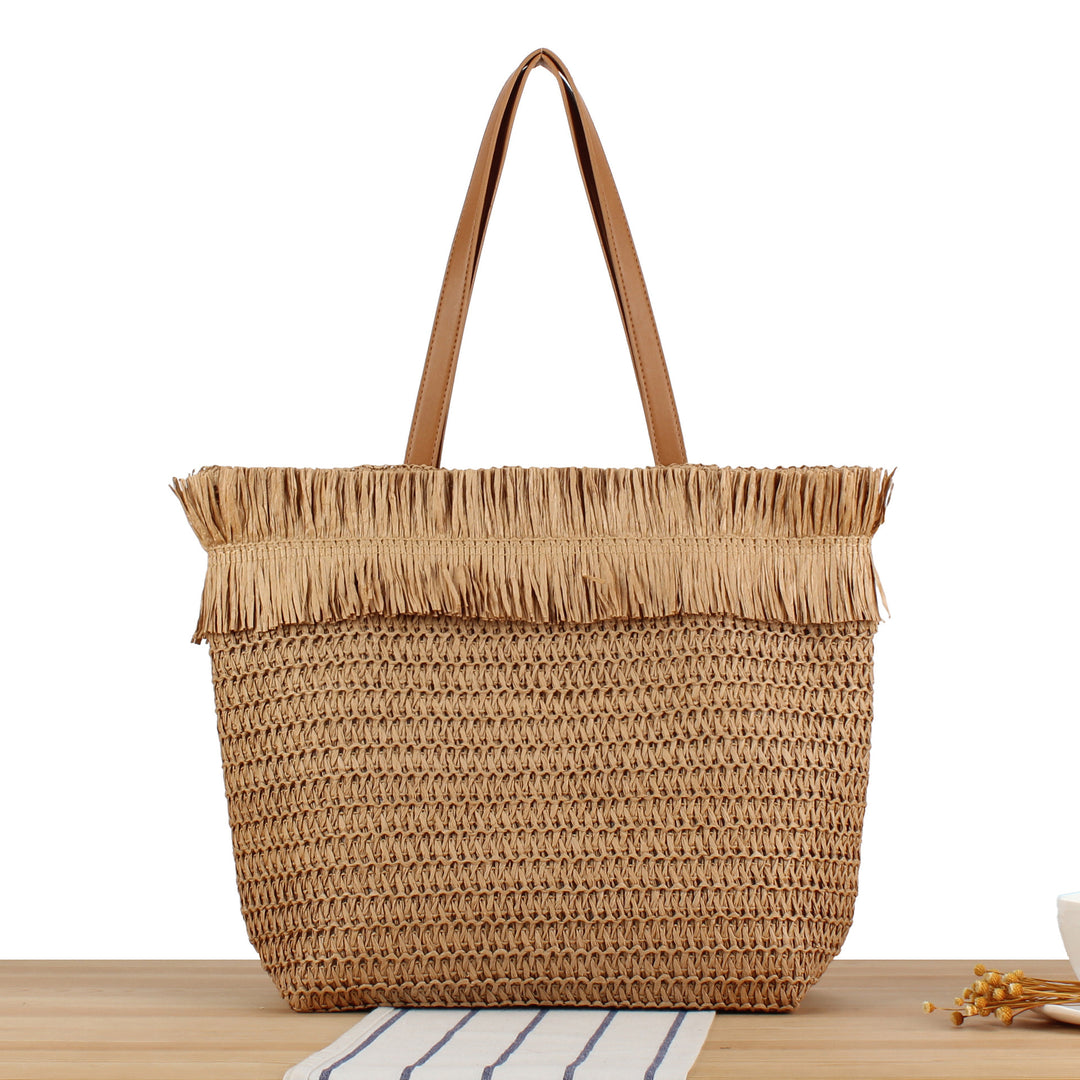 Strandtasche aus handgewebtem Naturmaterial mit Fransen-Detail Skanto