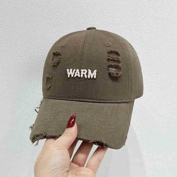 Damen Baumwoll-Cap im Used-Look mit gestickter Botschaft Skanto