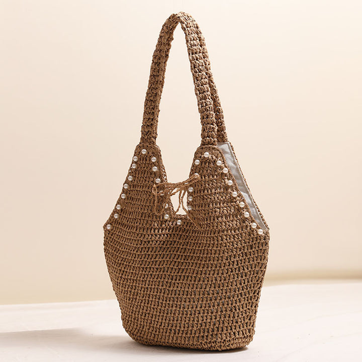 Handtasche mit Perlenverzierungen und innovativem Verschluss Skanto