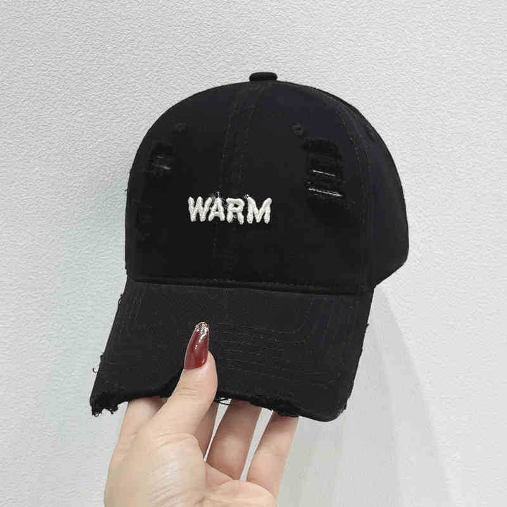 Damen Baumwoll-Cap im Used-Look mit gestickter Botschaft Skanto