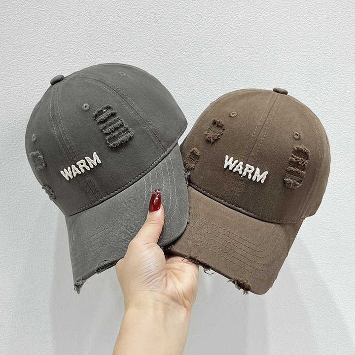 Damen Baumwoll-Cap im Used-Look mit gestickter Botschaft Skanto