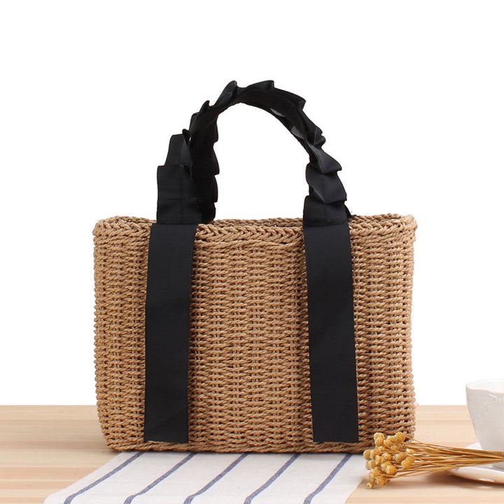 Geflochtene Handtasche mit eleganten Griffen Skanto