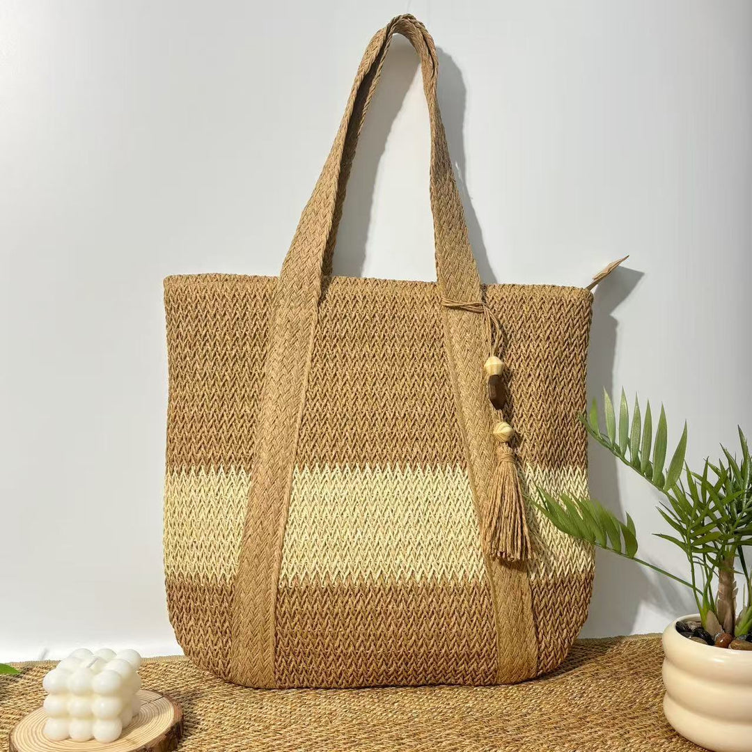 Handtasche aus natürlichem, handgewebtem Stroh mit eleganten Fransen Skanto