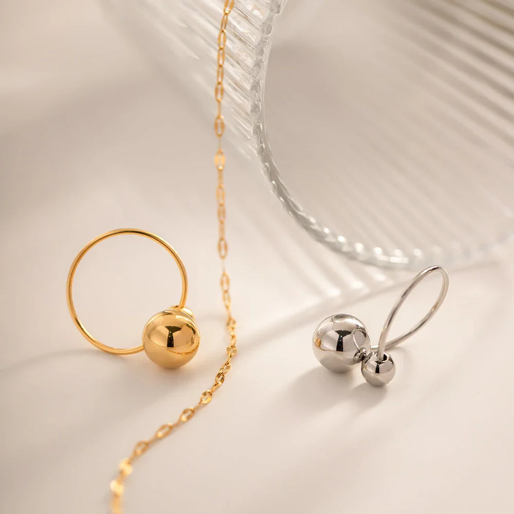 Skanto | 18k Markanter offener Ring mit zwei Kugeln