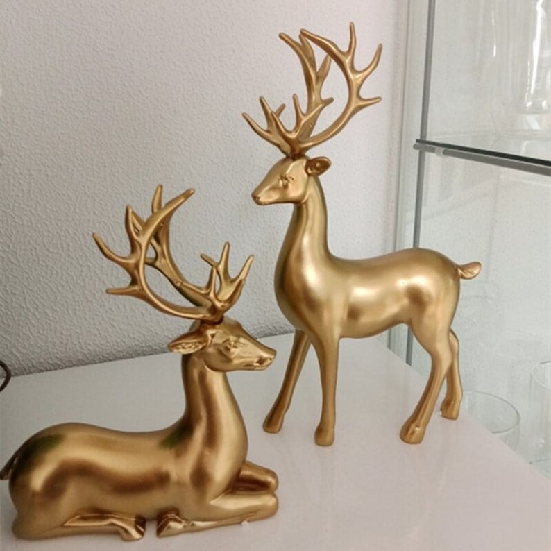 Skanto | Goldene Hirschfiguren