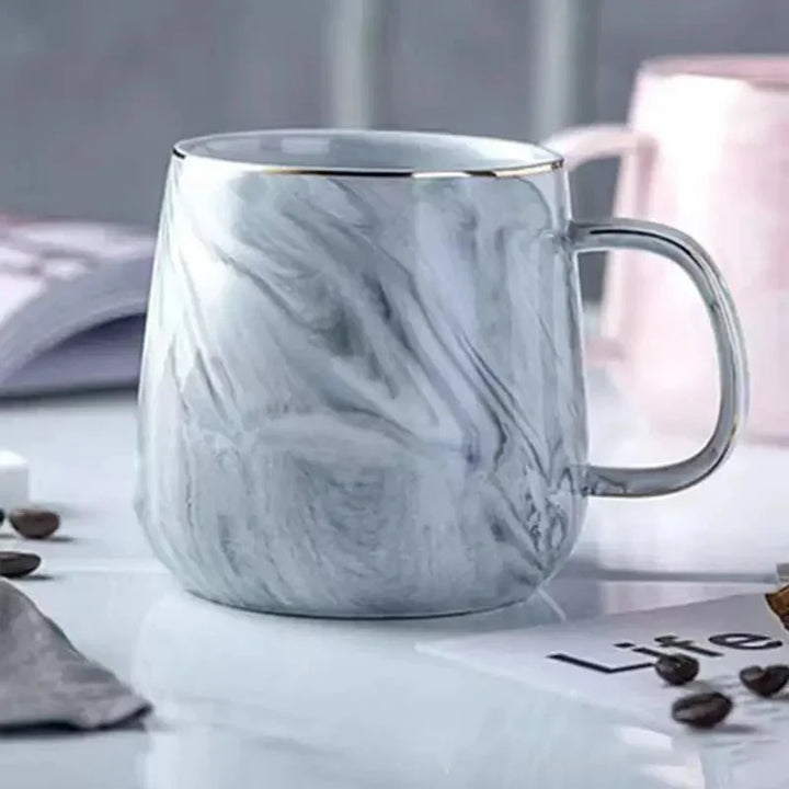 Skanto | Pastellfarbene Keramik-Kaffeetasse mit Marmormuster