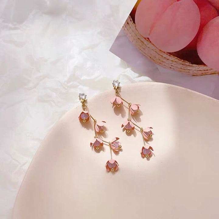 Skanto | Lange Strass-Kristall-Pink-Sakura-Blume mit Zirkon-Clip-Ohrringen